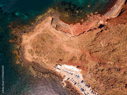 Canvas Print Top down aerial shot of volcanic headland and coastline near Red Beach Santorini