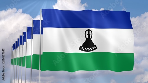 Foto Multiple Lesotho Flags Waving on Blue Sky Background