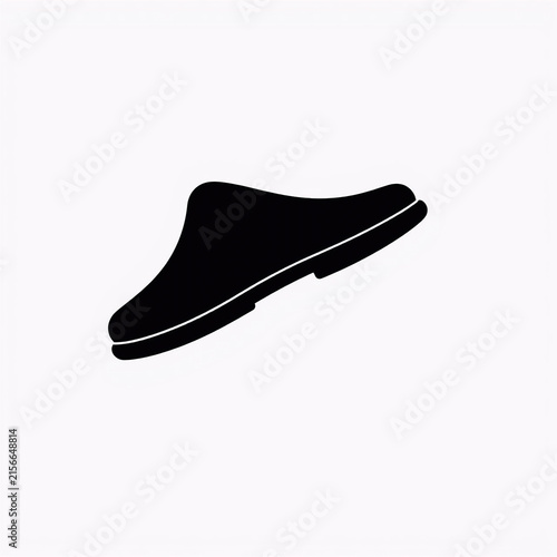 Black slip-on sneaker with white sole isolated on white. Minimalist casual footwear for fashion and lifestyle branding.