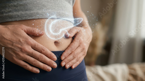 Insulin resistance concept with pancreas hologram over person holding their stomach showing concern for metabolic health and diabetes risk in soft indoor setting