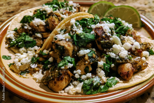 Rice bowl with mushrooms greens and lime wedges