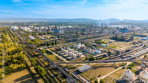Fotografie Aerial view of petrochemical complex surrounded by green fields