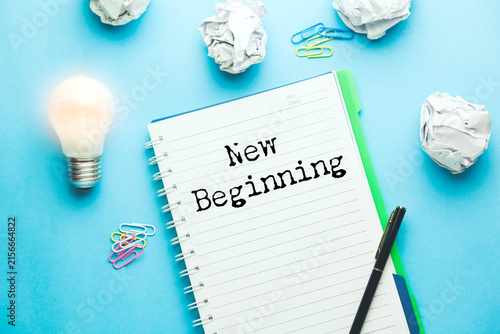 Фотография New Beginning text on paper