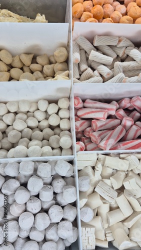 Assortment of Traditional Asian Candies and Snacks in Bulk Bins for Market Food Photography and Sweet Treat Concepts