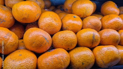Vibrant Fresh Oranges Displayed at a Market Stall, Perfect for Healthy Eating and Grocery Store Promotions