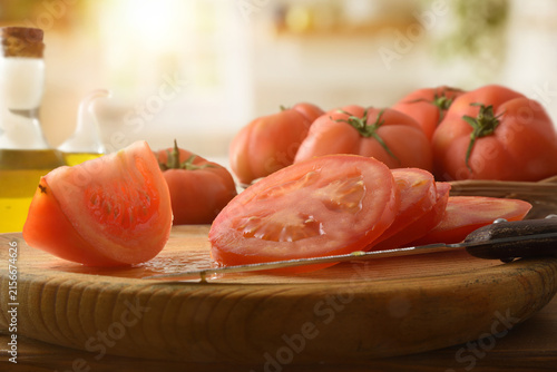Sliced Tomatoes on Rustic Wooden Cutting Board