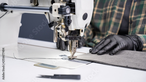A close-up of a sewing machine at work. 
