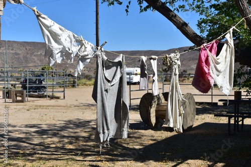 Outdoor Clothesline with Worn Laundry Drying in Desert Setting