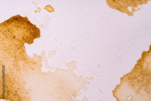 Brown coffee stain on white paper for vintage poster background