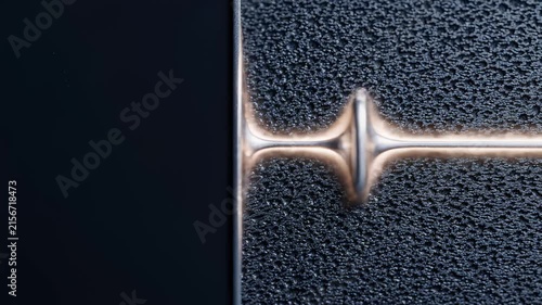 Abstract Metal Wave Pulse Moving Across Textured Dark Surface