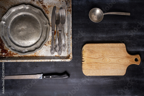Fotografía Old various kitchen utensils on black chalkboard background