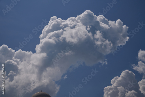 Dramatic Cumulus Clouds Against Deep Blue Sky