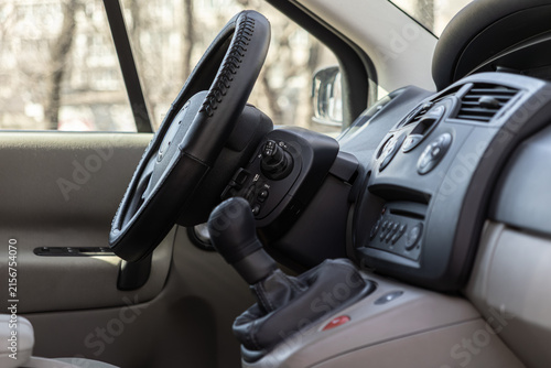 Canvastavla An interior view of a modern car cockpit featuring a leather steering wheel and