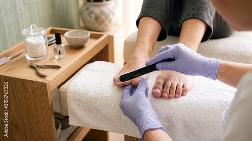 Professional pedicure treatment at beauty salon, symbolizing foot care, hygiene, wellness, relaxation, self-care and healthy feet.