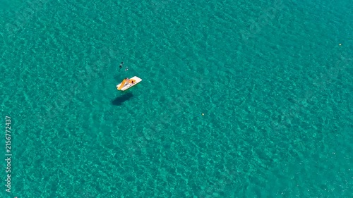 Orange and white watercraft floating