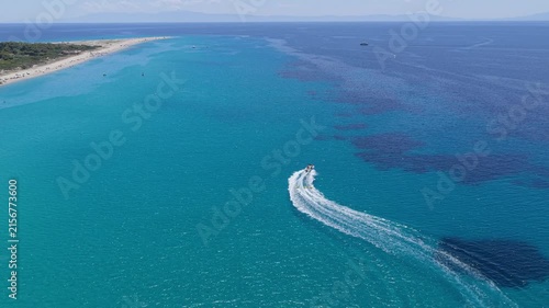 Speedboat carving a sweeping turn