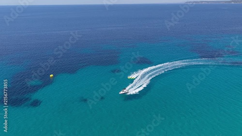 Speedboat carving a sweeping wake