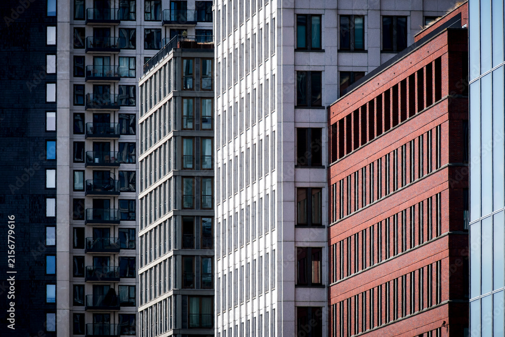 Fototapeta premium Colorful high rise buildings. A mix of businesses, offices and apartments. Photo taken in the city center of The Hague, The Netherlands.