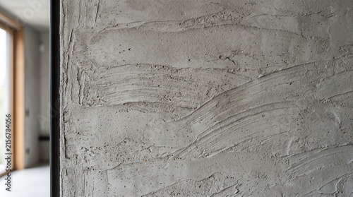 Grey cement wall texture with plaster strokes. Rough concrete surface for interior design.