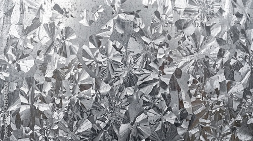Galvanized steel sheet with zinc pattern. Metallic texture of industrial metal surface.