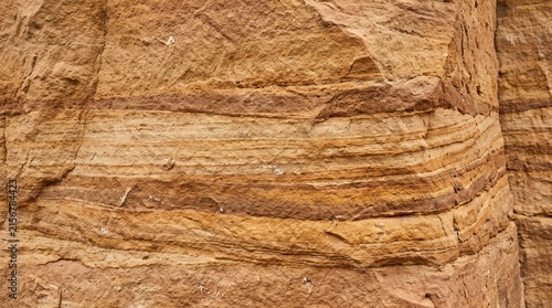 Natural sandstone wall texture. Earthy geological rock layers with rough stone patterns.