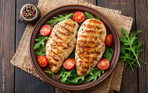 Chicken breast with fresh salad - arugula and tomato