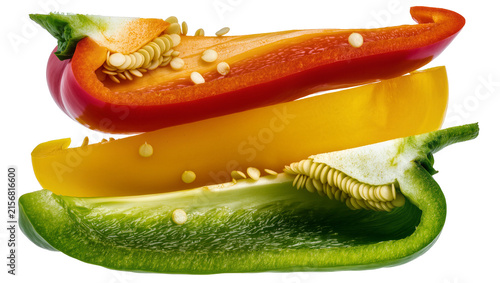 Red yellow and green bell pepper slices with seeds, isolated on transparent background
