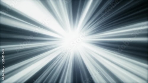 Bright white light rays emanate from the center against a dark blue background.
