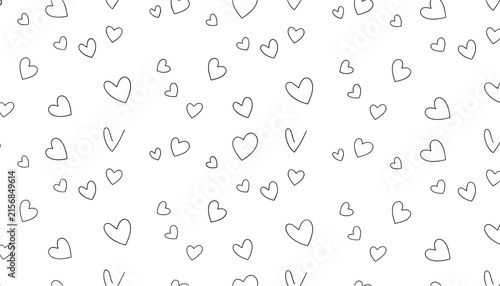 Romantic seamless pattern background with tiny hand-drawn outline hearts scattered over a white backdrop.