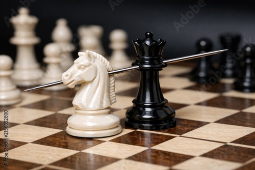 Close-up view of a chess board featuring a horse piece