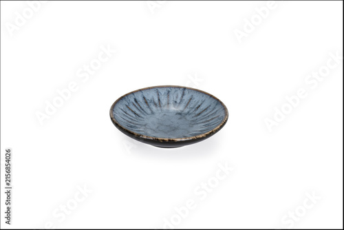 Canvastavla shallow, handcrafted ceramic dish or saucer featuring a reactive crystalline glaze with soft oceanic blue-green and earthy tones
