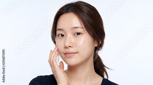 Beautiful Asian Woman Touching Her Clean Smooth Face