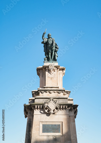 The monument depicted in the image is the statue of Roger de Llúria, the renowned admiral of the Crown of Aragon, located at the end of the Rambla Nova in Tarragona, Spain.