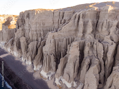 Принти на полотні Close up drone view of dramatic sculpted pumice volcanic cliffs at Vlichada beac