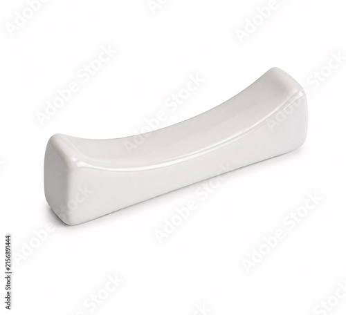 Close-up of modern white ceramic brush rest