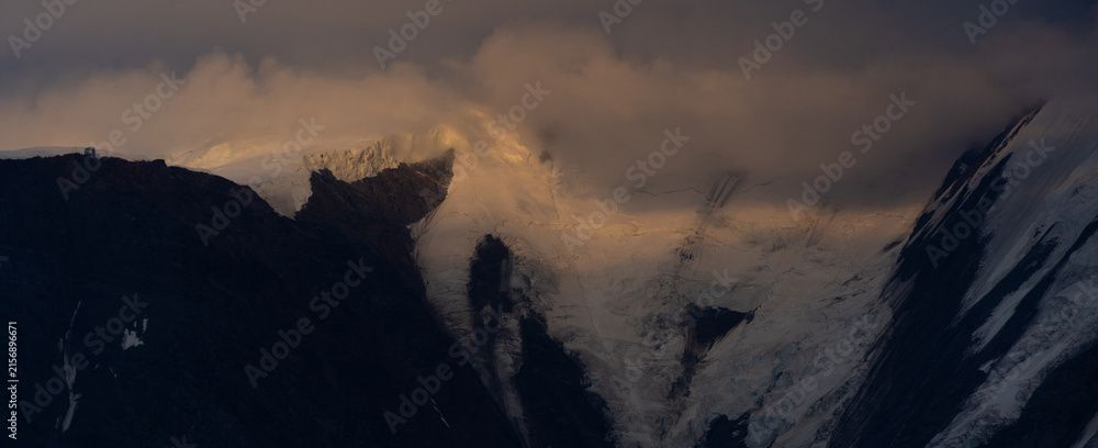 Naklejka premium Summer view of the Mont Blanc massif above forested slopes 