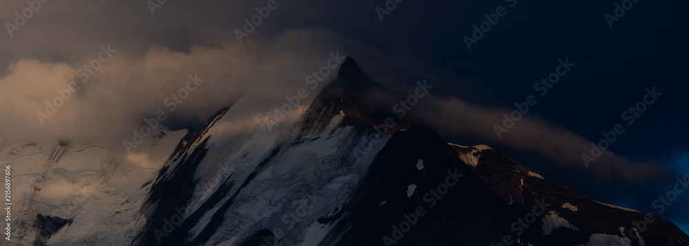 Naklejka premium Summer view of the Mont Blanc massif above forested slopes 