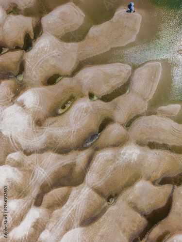 Aerial view of extreme low water level and exposed sandbars on Danube River caused by severe drought and climate change near Apatin, Serbia.