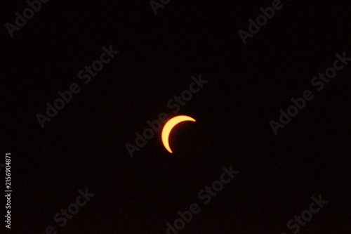 Fotografie Thin Crescent Sun During Solar Eclipse Over Fleurie, France