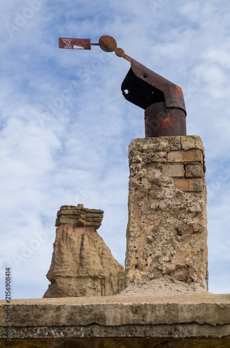 A chimney of an old adobe house in the semi-desert Bardenas Reales, Spain
