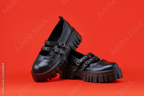 Canvastavla Black women's shoes on a red background