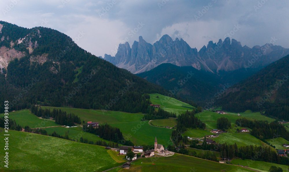 Obraz premium Landscape village Santa Maddalena in mountain valley at sunset in Dolomites, Italy. St. Magdalena and mountains. Val di Funes