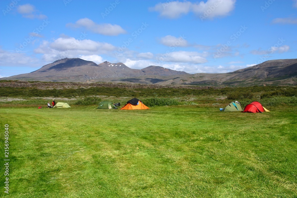 Naklejka premium Outdoor vacation adventure. Camping tents at a campground in Thingvellir National Park in Iceland.