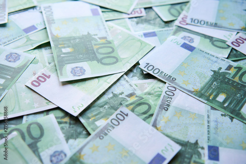 Money background of scattered one hundred euro bills