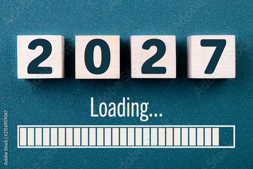 Wooden cube block 2027, countdown to 2027. Loading year to 2027. New year start concept, business, resolutions, goals, inspiration, success, ideas