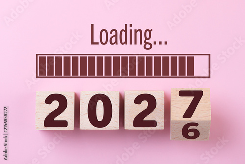 Wooden cube block 2027, countdown to 2027. Loading year to 2027. New year start concept, business, resolutions, goals, inspiration, success, ideas