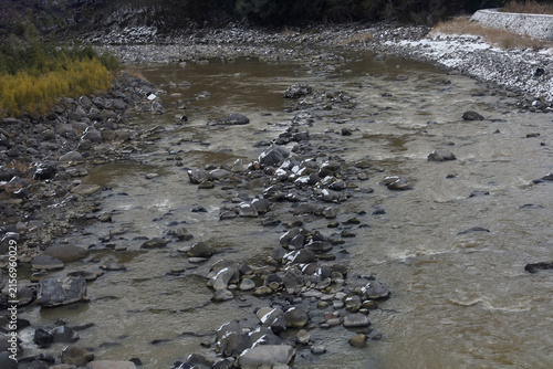 Rocky Mountain River with Snow-Dusted Stones in Winter Japan