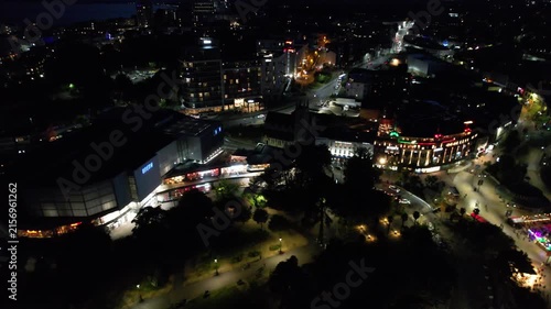 High Angle Night Footage of Illuminated Buildings and Roads with Traffic at Best Tourist Attraction Destination of England at Bournemouth City with Sandy Beach and Ocean of Great Britain, 