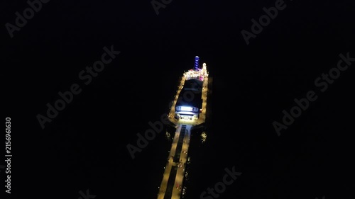 High Angle Night Footage of Illuminated Buildings and Roads with Traffic at Best Tourist Attraction Destination of England at Bournemouth City with Sandy Beach and Ocean of Great Britain, 
