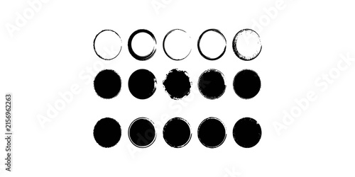 A set of fifteen black grunge and ink brush stroke circle frames and solid shapes on a transparent background for design.
